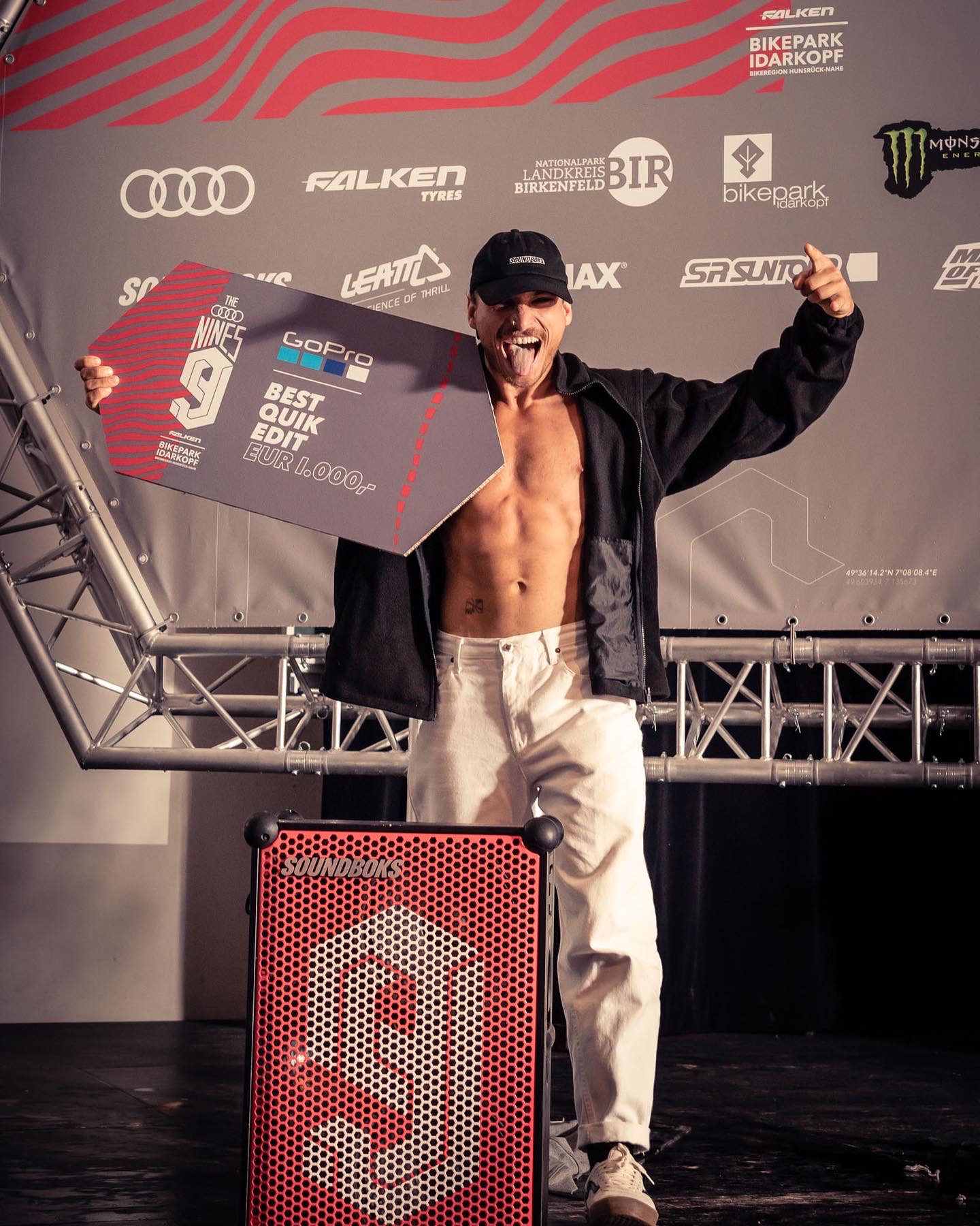 Ruso celebrating a contest win with prize cheque
